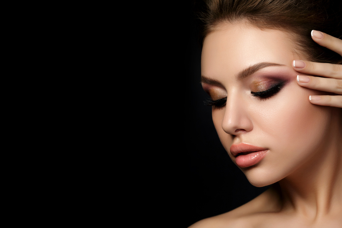 Portrait of Young Woman Wearing Glam Makeup 